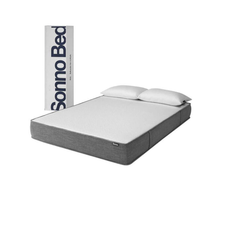 A modern bed with a grey upholstered frame and a white mattress is positioned in front of an upright rectangular box labeled "Sonno Bed." Two white pillows rest at the head of the mattress. The background is plain white, perfectly highlighting the sleek design of the Sonno bed.