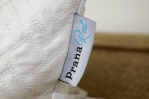 prana rest pillow tag with logo