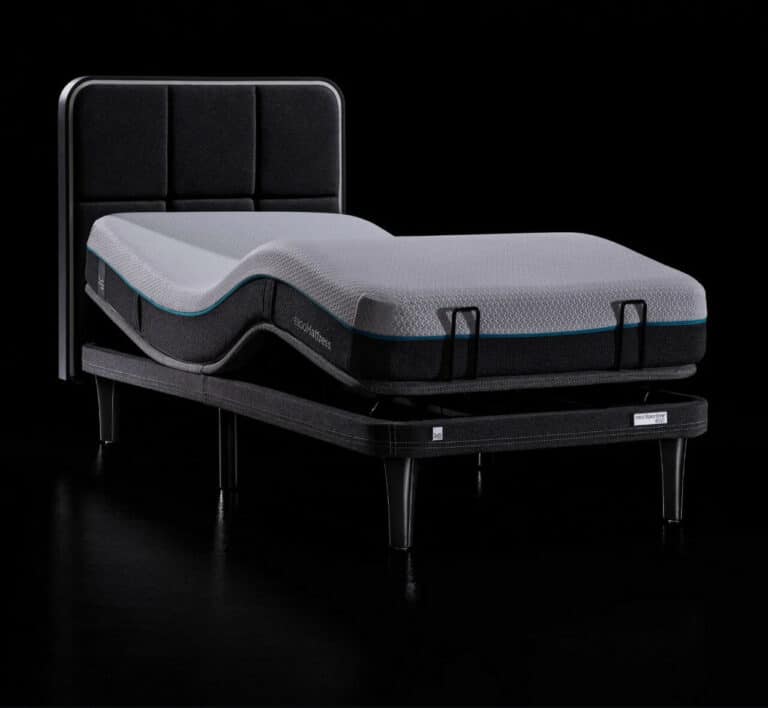 The Ergo Sportive Adjustable Smart Bed, featuring a sleek black frame and headboard, is displayed against a black background. The mattress showcases a white top with segmented dark trim and is supported by four sturdy legs. The mattress appears articulated in a raised position.