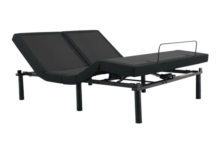 The DUETTO Split Top Adjustable Base is an adjustable black bed base featuring a split design, which allows for individual customization of each side. It comes equipped with metal legs and includes a foot rail on one side, with both the head and foot sections being elevated.