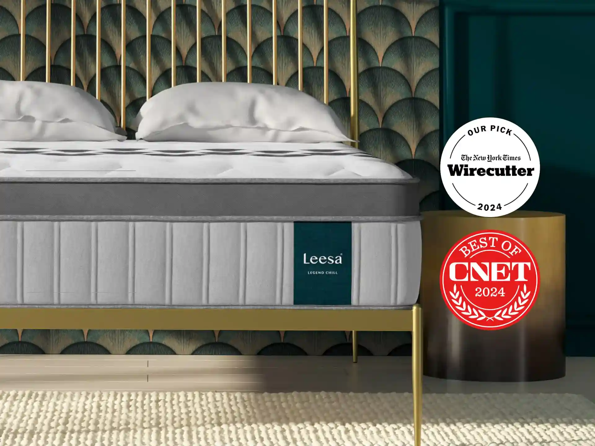 A stylish bedroom with a Leesa mattress on a gold bed frame. The backdrop features a geometric wall design in shades of green. To the right, two awards are displayed: "Wirecutter 2024" and "CNET Best of 2024." A textured beige rug covers the floor.