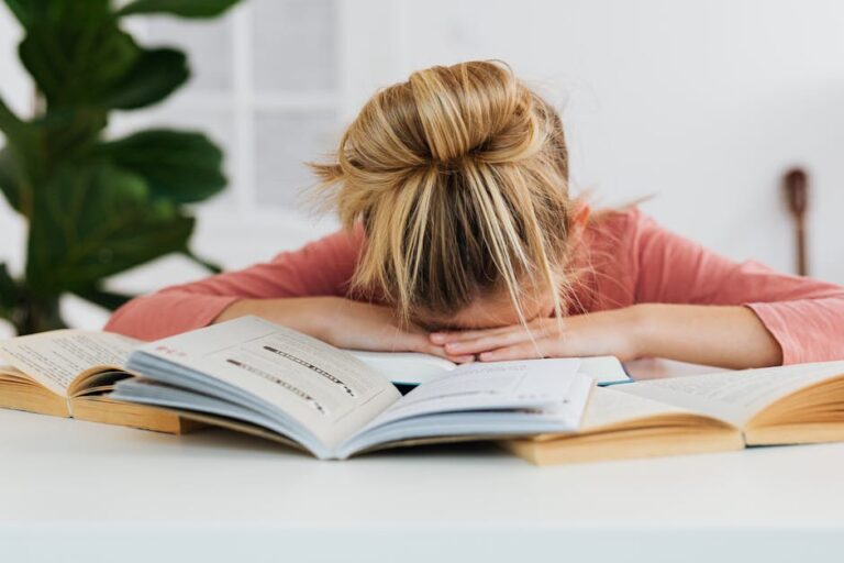 a woman with her head on a book