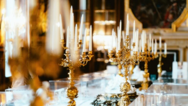 a group of candlesticks with candles on them