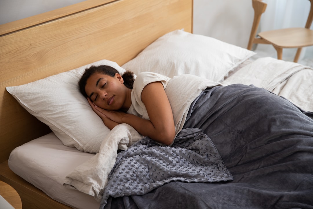 a woman sleeping in a bed