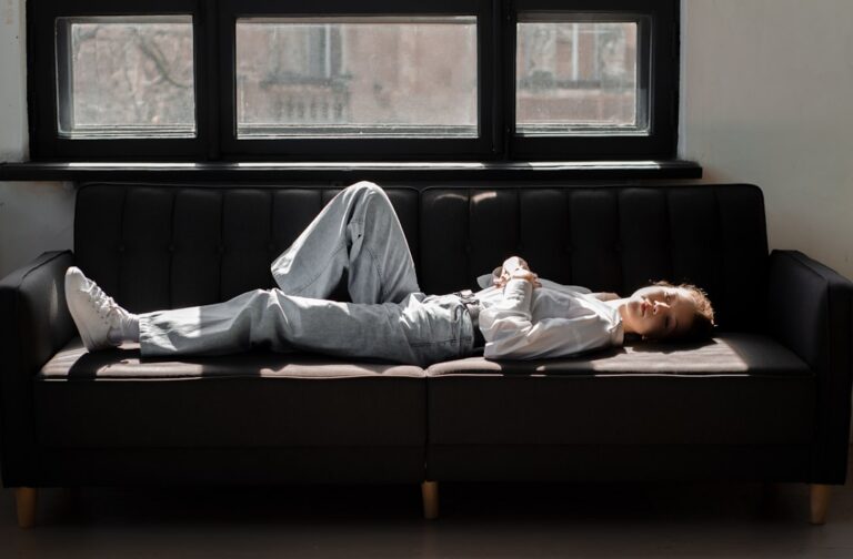 a person lying on a couch