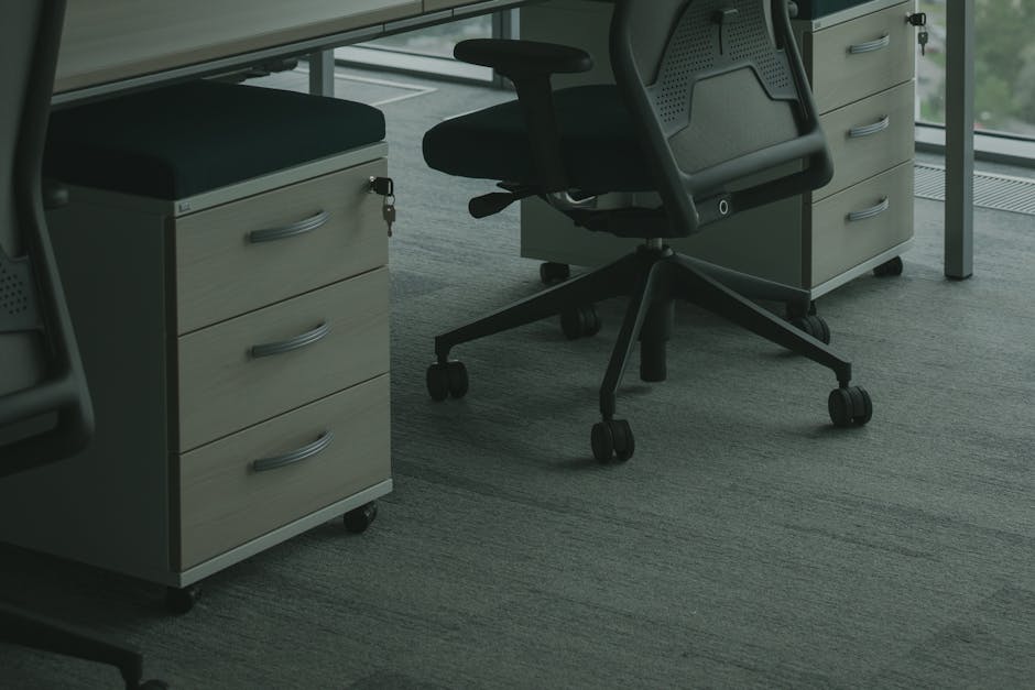 a chair and drawers in an office