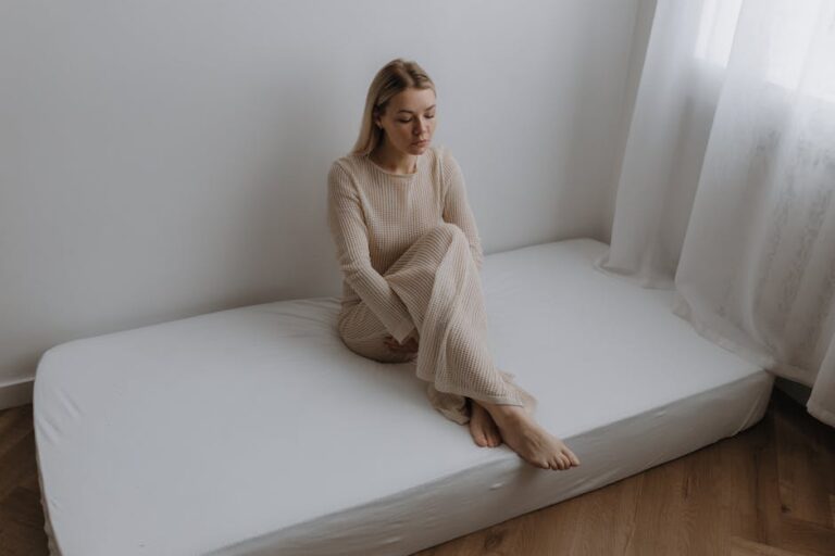 a woman sitting on a bed