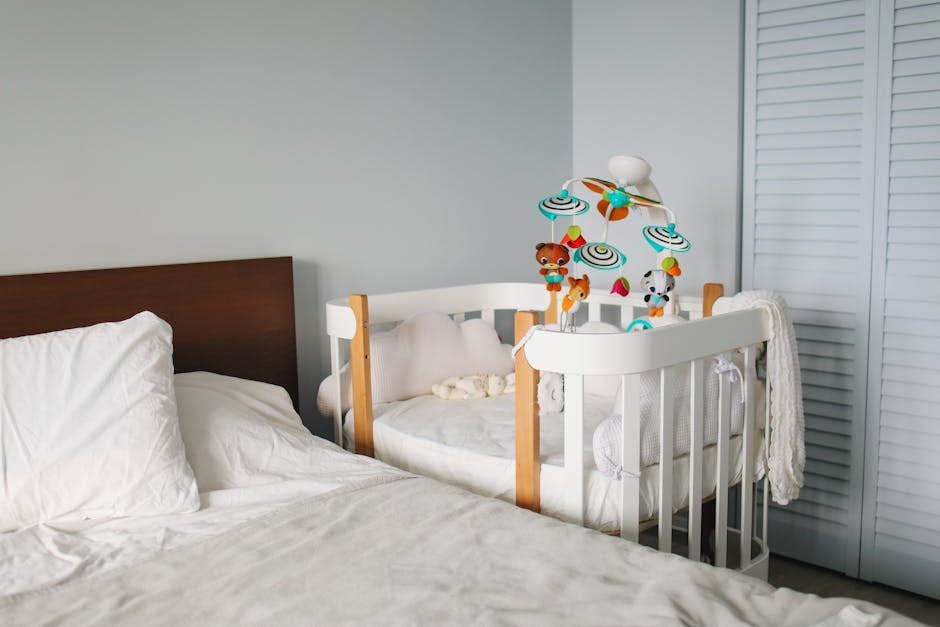 a baby crib with toys in a room