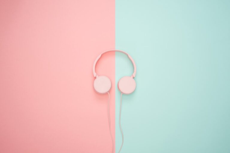 a pink headphones on a pink and blue background