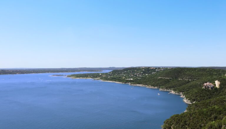 a body of water with land and buildings