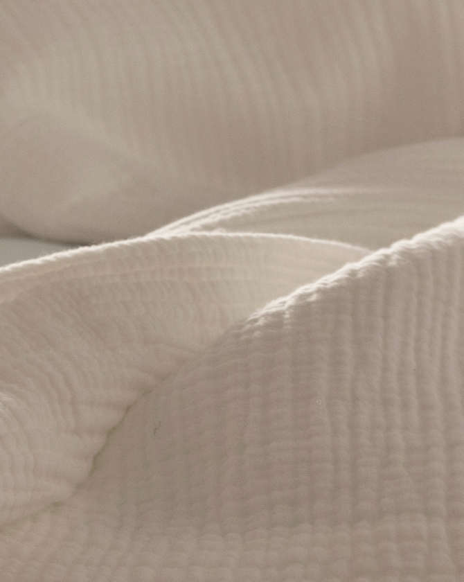 a close up of a white blanket