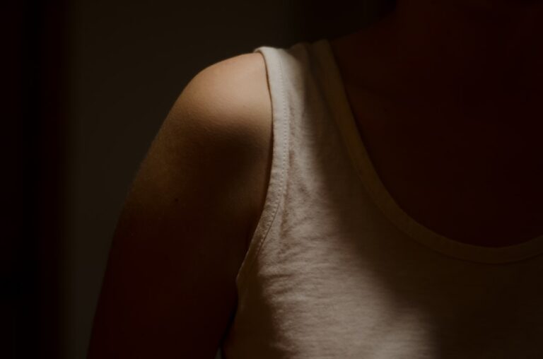 a close up of a woman's shoulder