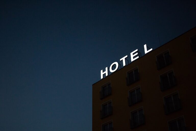 a hotel sign on top of a building