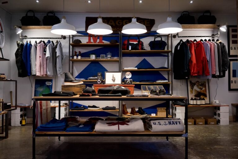 a store with shelves and shelves with clothes and a shelf with lights