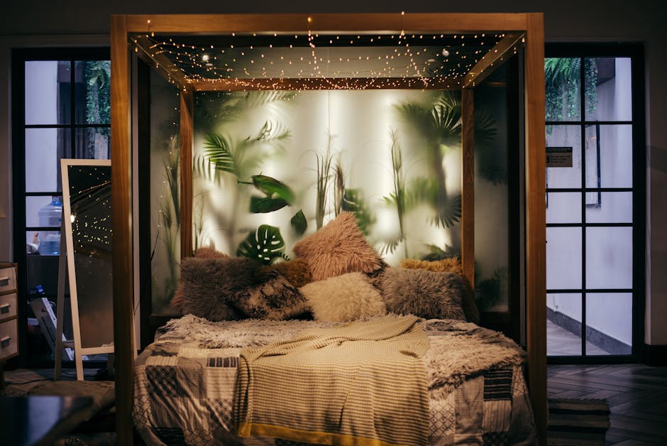 a bed with pillows and lights