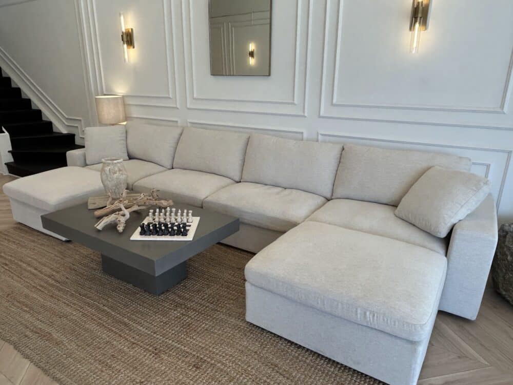 7th Avenue sectional arranged as a chaise modular sectional in a family room