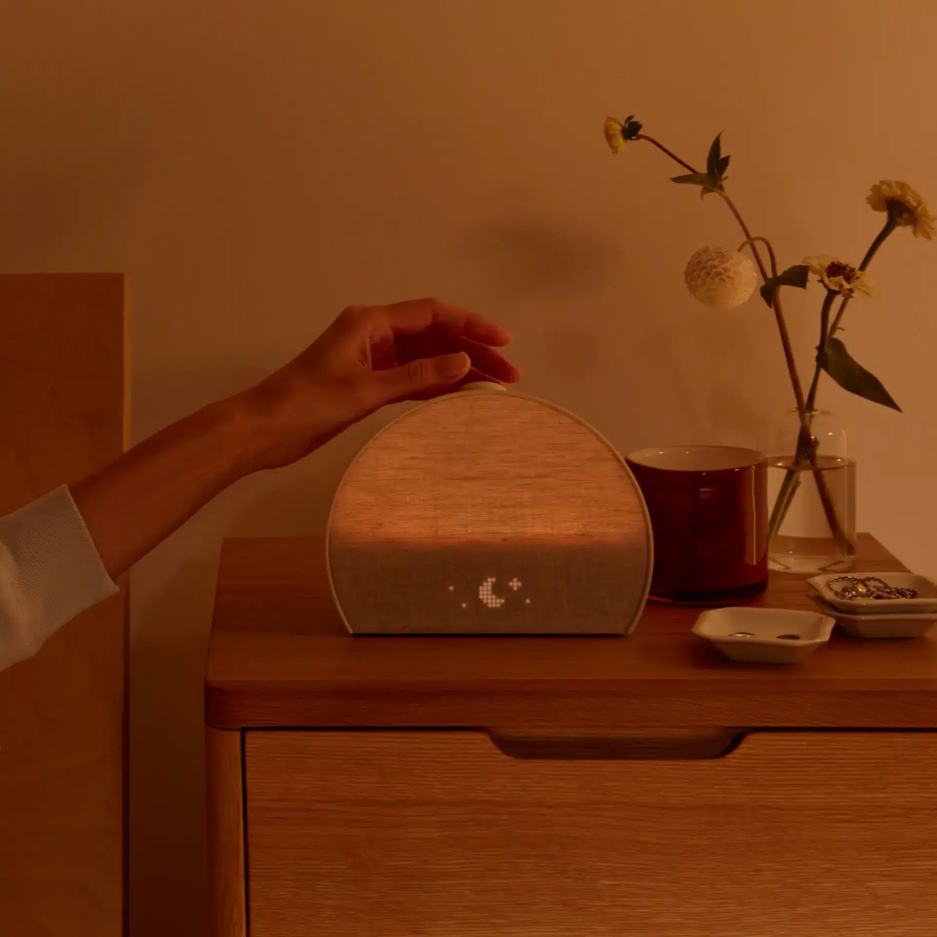 Hatch Restore sunrise light routine in a dark bedroom