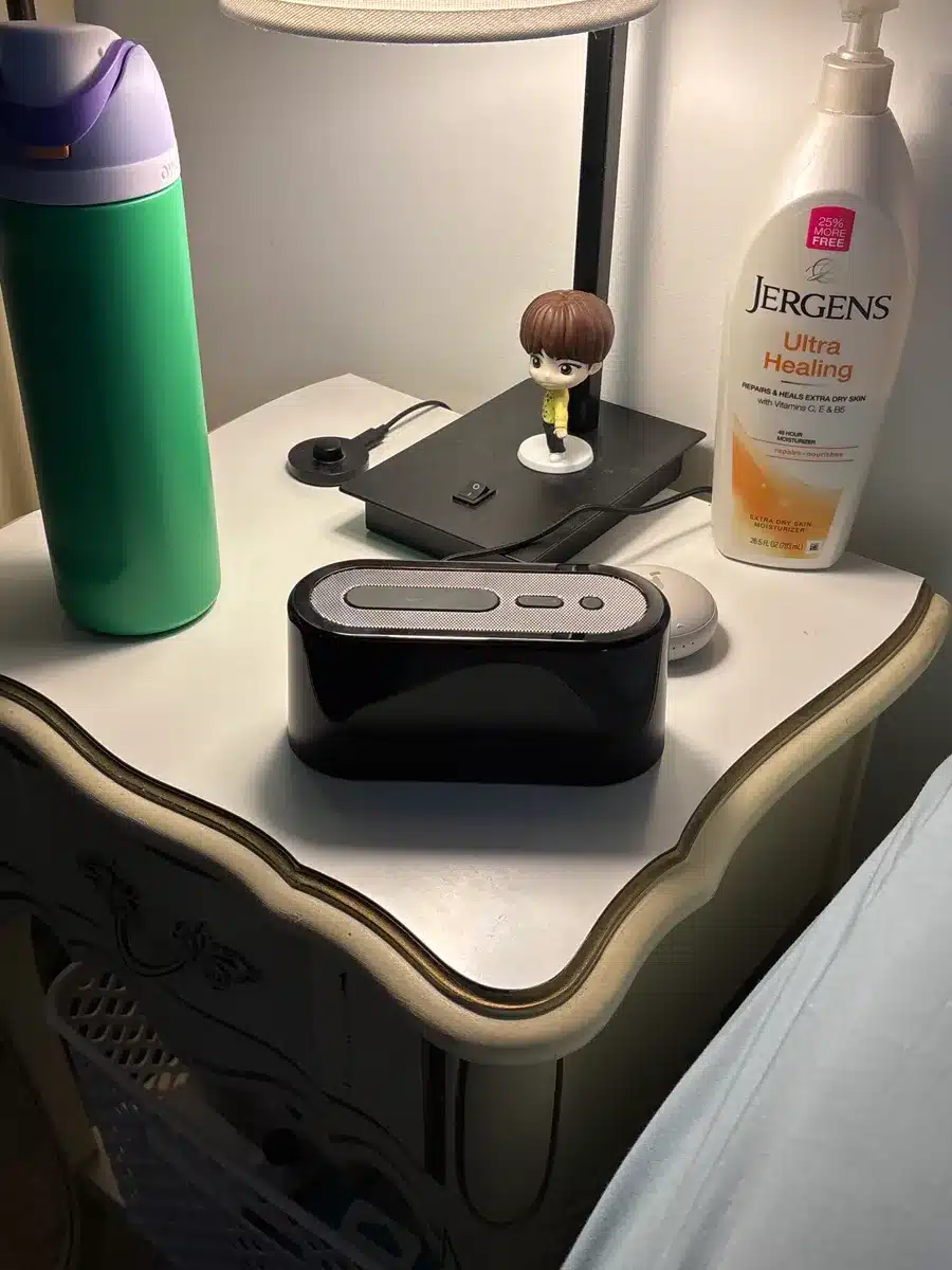 Loftie alarm clock styled in a minimalist bedroom