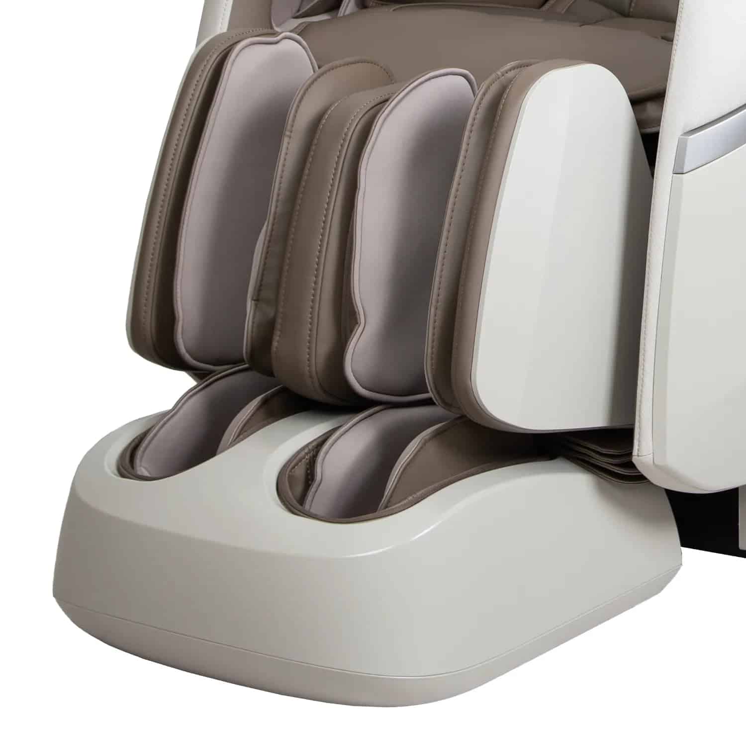 Close-up of a massage chair's footrest in white and beige leather.