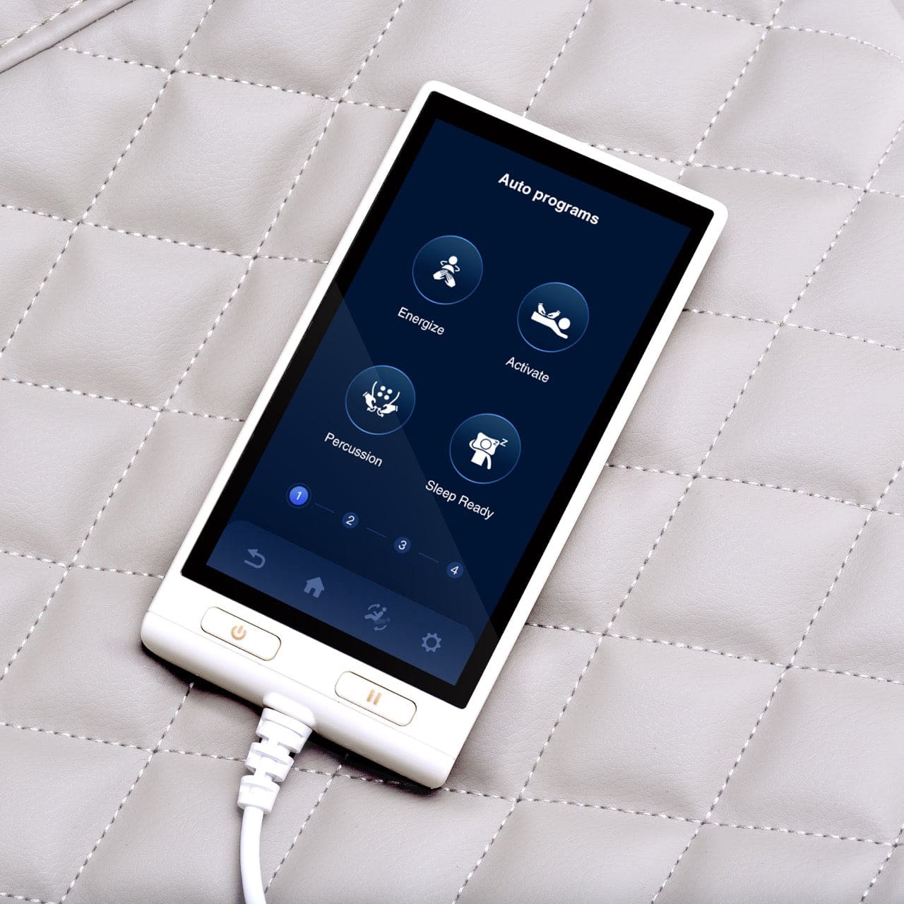 White controller for a Vito smart sleep product with "auto programs" on screen, on a quilted gray surface