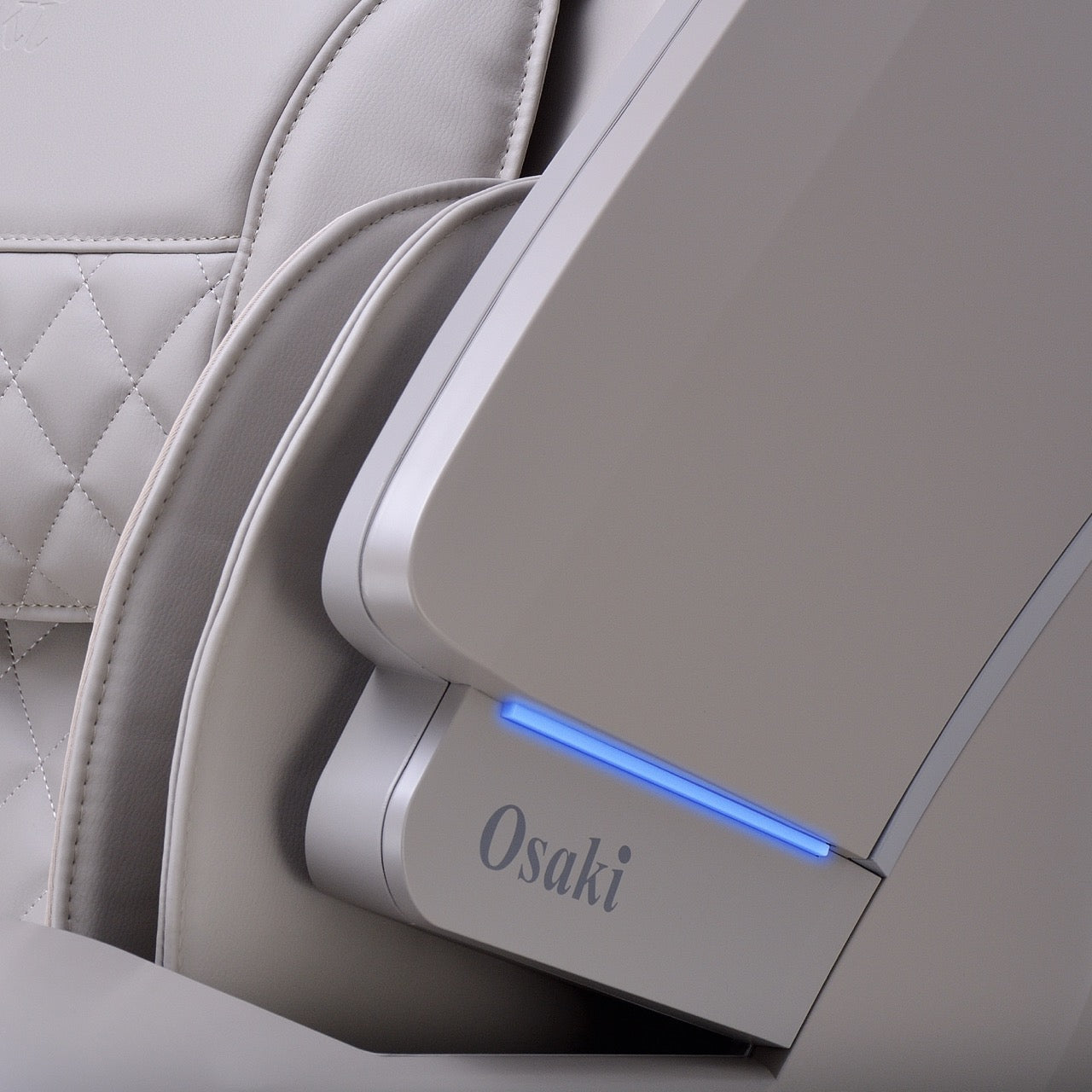 Close-up of a light gray Vito massage chair with a blue LED strip