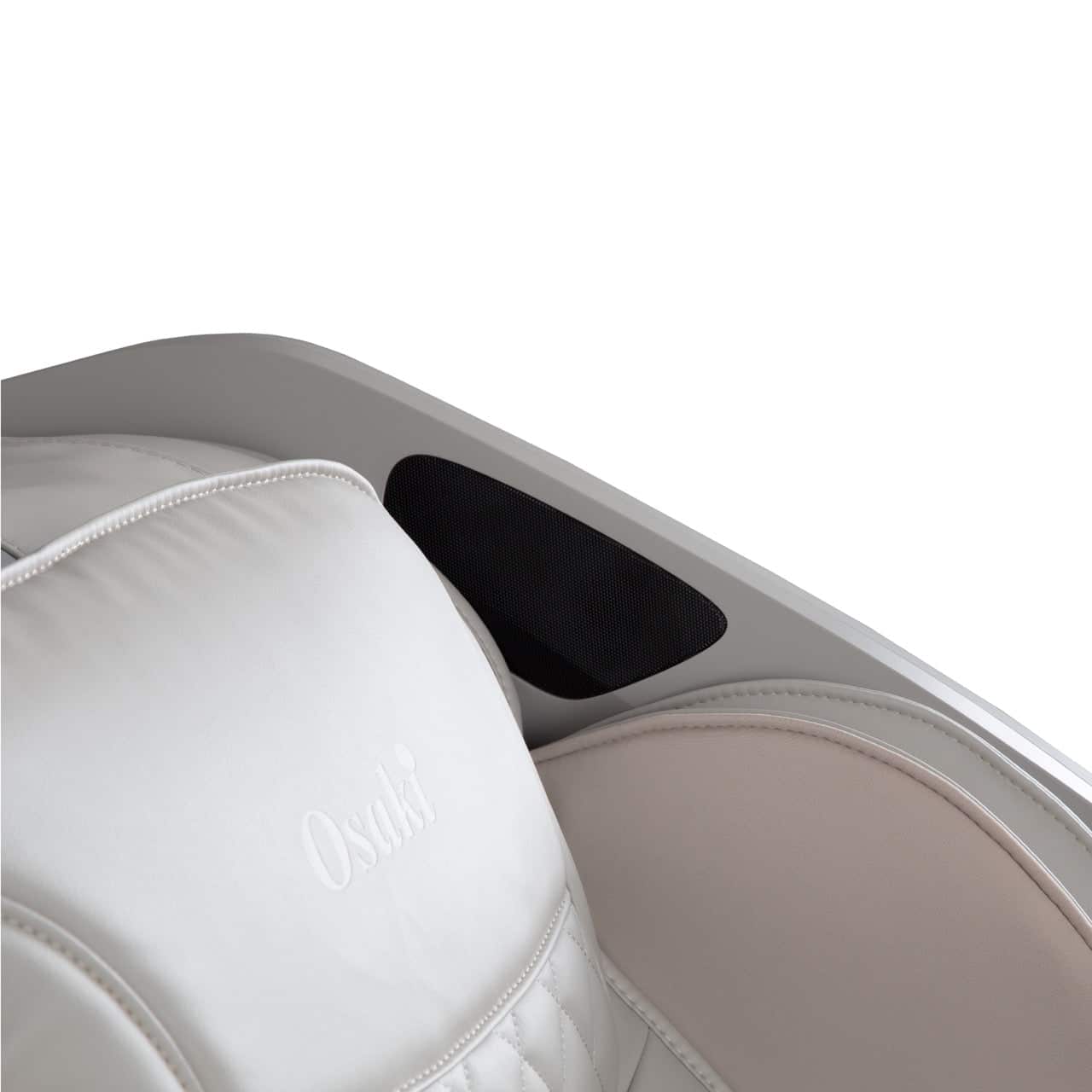 Close up of an off-white massage chair with black speaker and Osaki logo