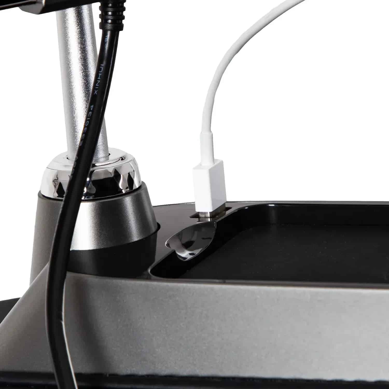 Bravo Duo Flex lamp base with a white USB cable plugged into its charging tray