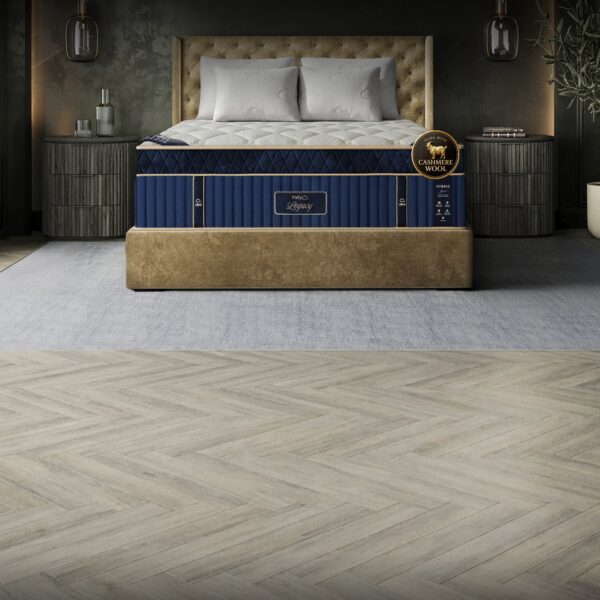 Puffy Legacy mattress within an elegant bedroom with dark wall and herringbone floor