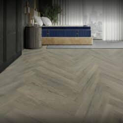 Legacy mattress with a blue quilted top and beige upholstered base in a stylish bedroom