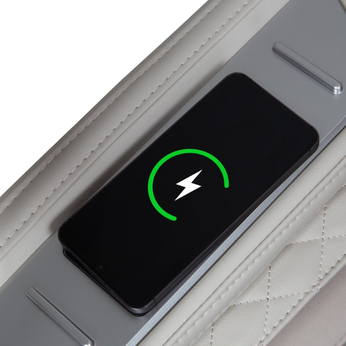 Black smartphone charging on the grey Osaki Helix LE Taupe massage chair armrest.