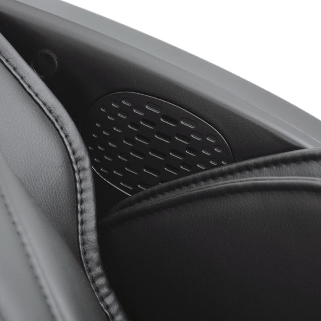 Close up of the solo flex speaker grilles and black leather cushioning