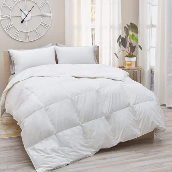 White 330 Down Comforter on a queen bed with white pillows and neutral decor