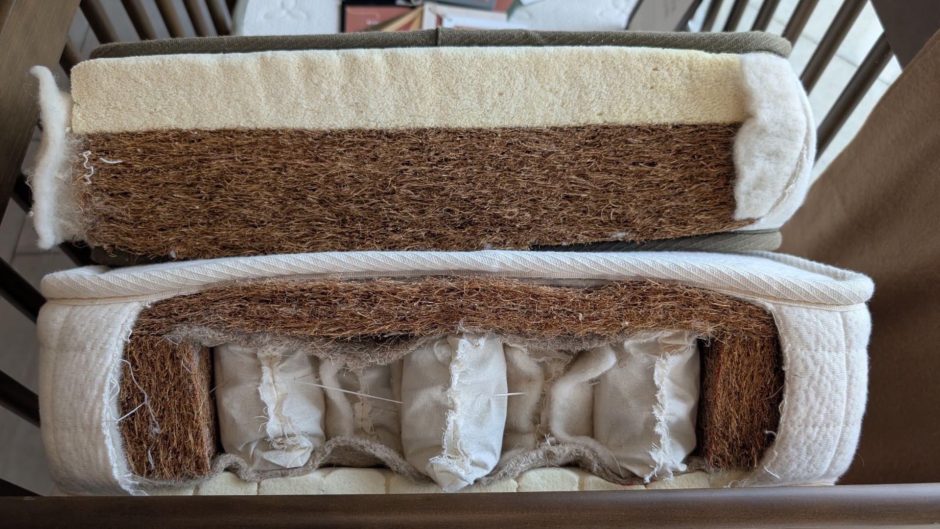 Avocado organic crib mattress cutaway showing the internal layers