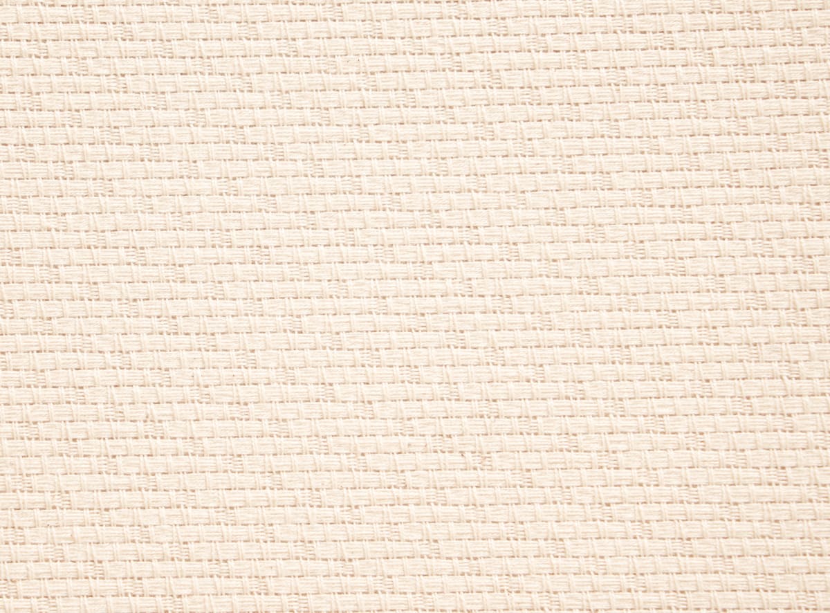 Cream-colored woven Carousel Foundation fabric texture with small square patterns