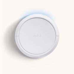 Pura 5 smart fragrance diffuser, white and round with glowing blue light.