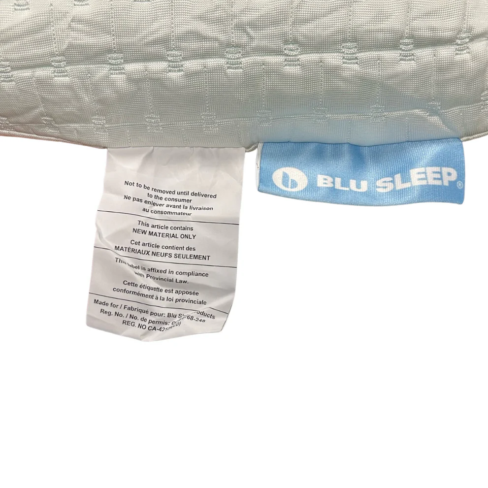 White pillow fabric with a tag showing Blu Sleep logo and material information
