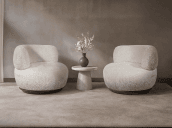 Two Selene Champagne boucle chairs with a small table between them