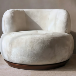 Puffy Selene Swivel Chair in white velvet fabric with a wooden base on carpet