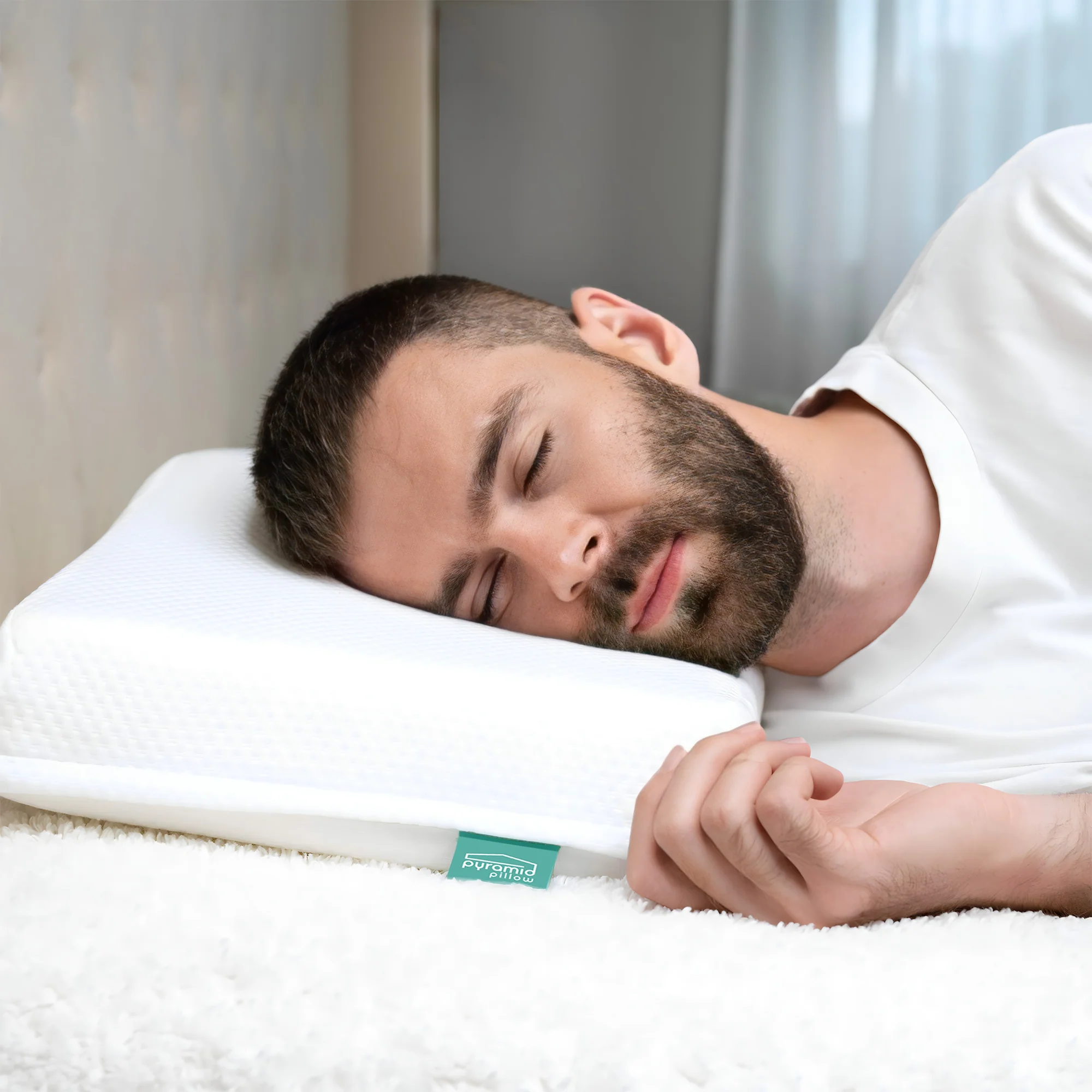 Man sleeping on side using the Pyramid Pillow anti-snore wedge