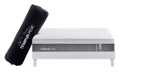 TEMPUR-Cloud mattress rolled in shipping bag against a bed