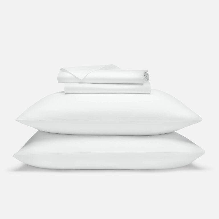 Brooklinen Luxe Sateen Core Sheet Set in white on a bed