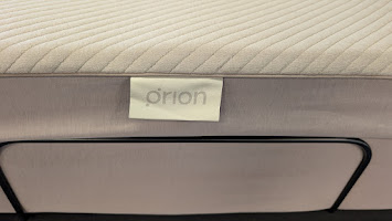 Close-up of the Orion Sleep cover installed on a mattress