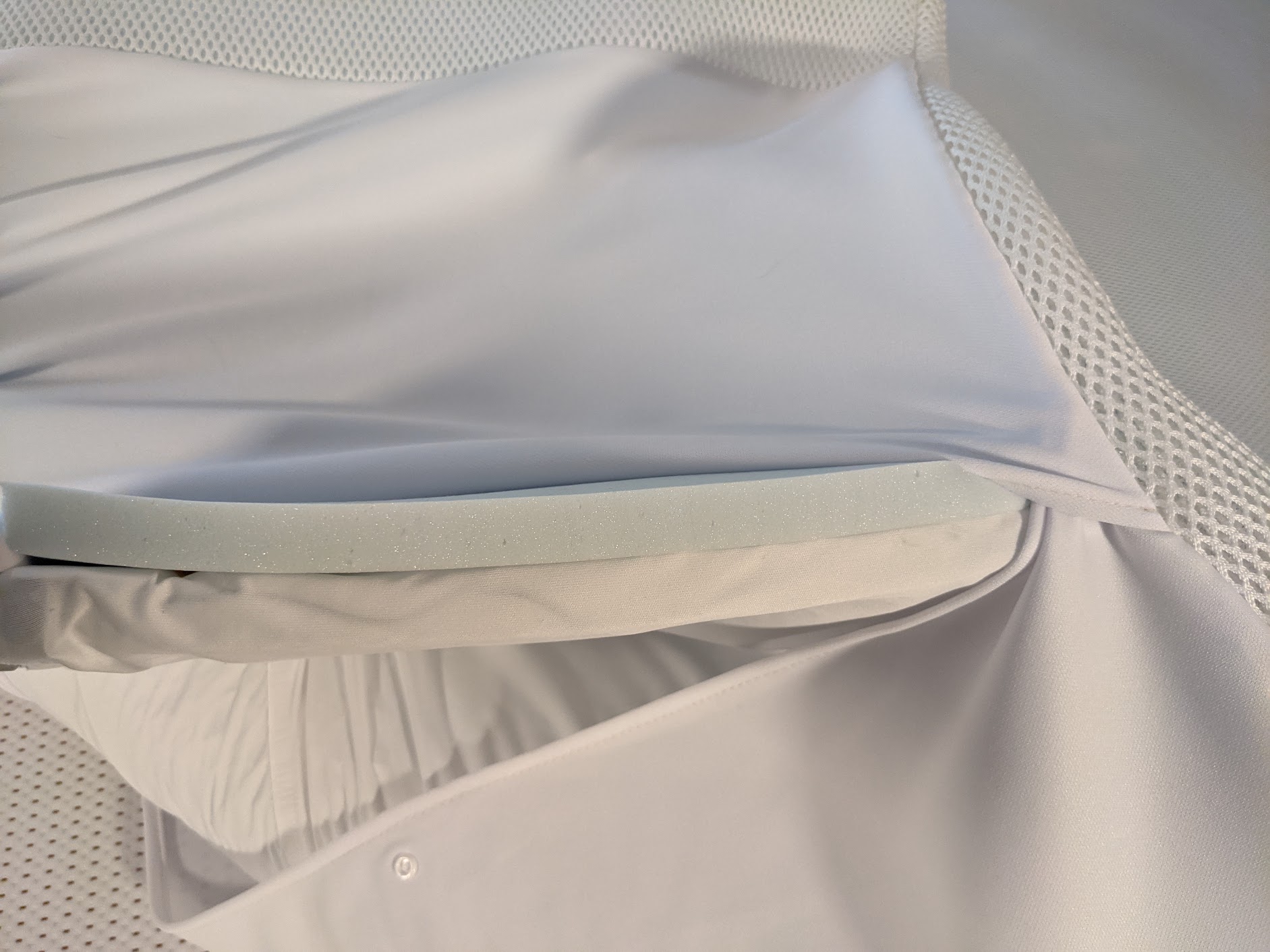 Close-up of the Perfectly Snug Smart Topper foam and cover layers during Yawnder testing