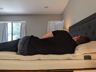 Side-profile view during hands-on testing of the Perfectly Snug Smart Topper