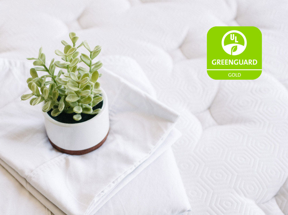 Tufted mattress cover with GREENGUARD Gold badge