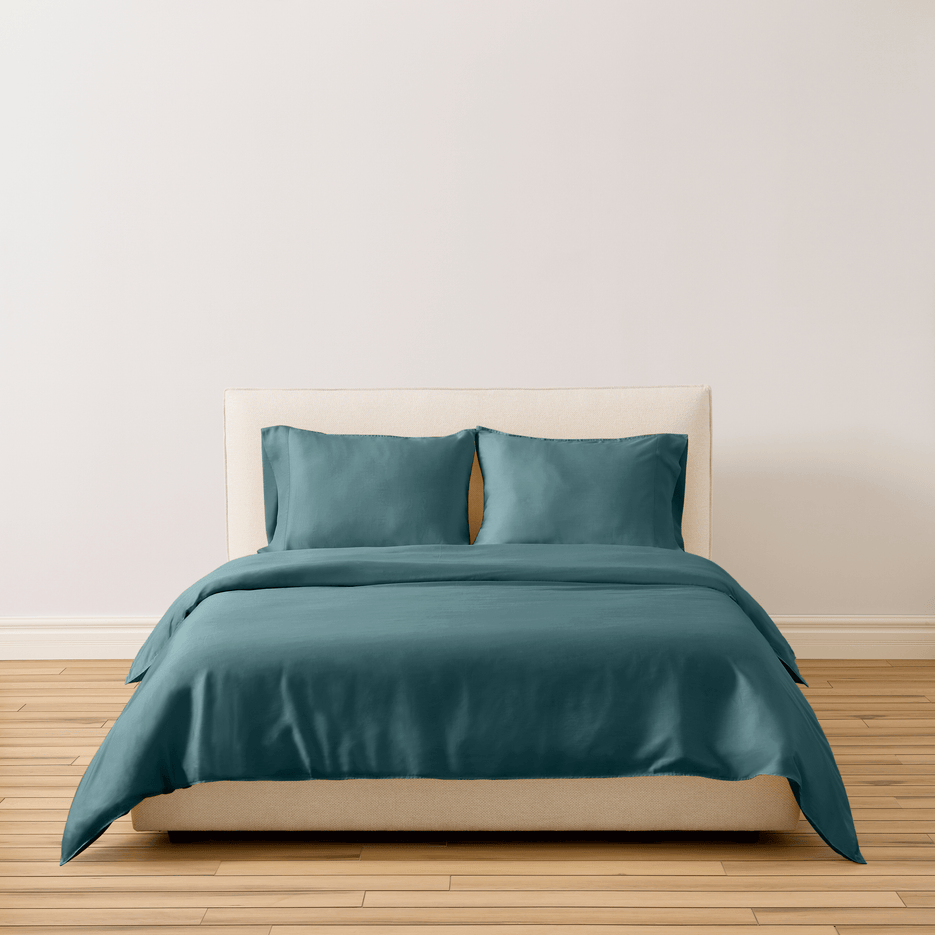 Buffy Breeze eucalyptus lyocell sheets in teal on a made bed