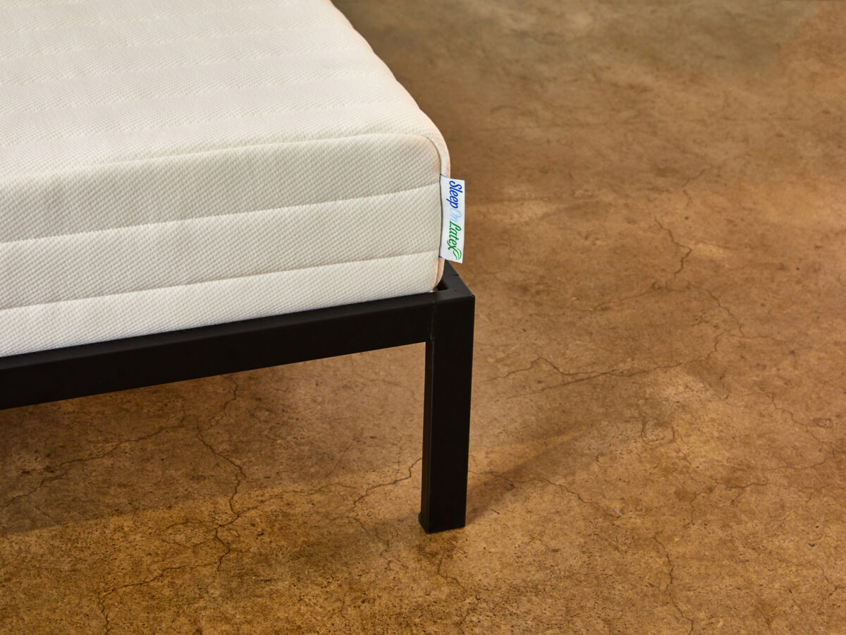 Close view of the Sleep On Latex Pure Green mattress corner and cotton cover