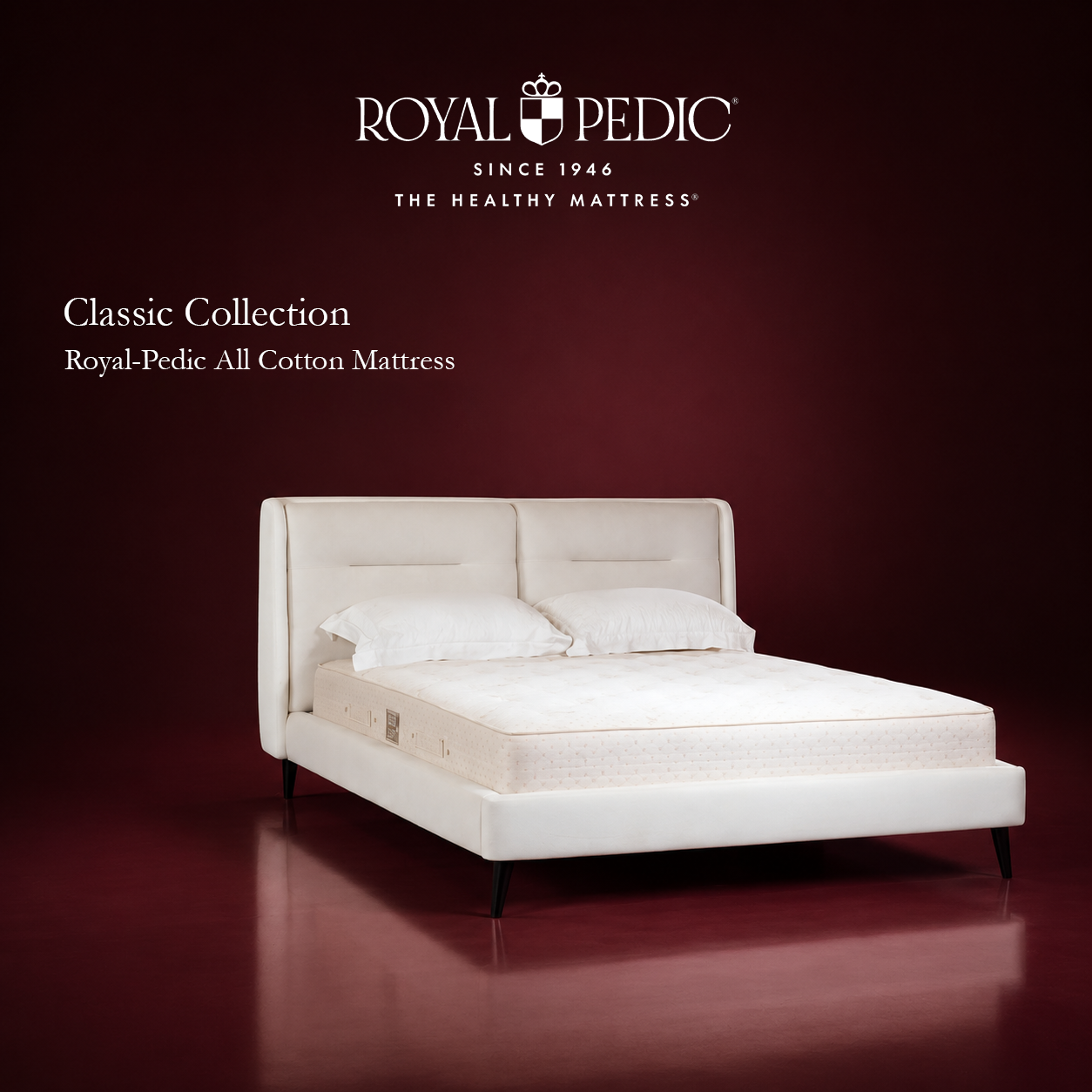 Royal-Pedic All Cotton mattress with tufted surface on an upholstered bed