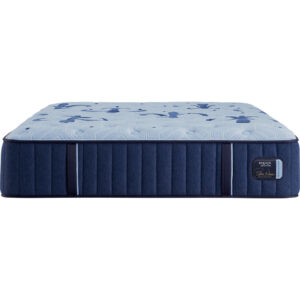 Stearns & Foster Estate collection firm mattress showing pale blue quilted top, navy side panels and Estate badge.