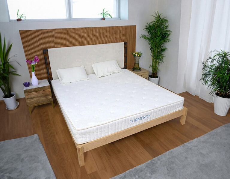 Turmerry flippable latex mattress shown on a wood bed frame